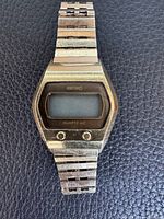 Front view showing entire watch, bracelet, and LCD face