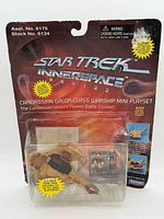 Front of sealed package showing playset and figures