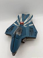 Top view of blue and white Jedi Starfighter