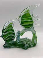 front view showing two angelfish and wave base