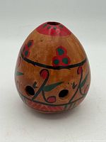 Front view showing floral design and finger holes