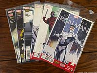 Stacked view of all six bagged issues showing top cover of issue #1