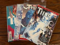 Four bagged Thor comics overlapped