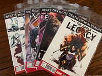 Fanned view of the seven bagged comics