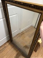 Full view of rectangular mirror showing frame and glass
