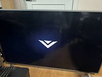 Front view of powered-on Vizio 55" TV