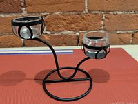 Full view of metal stand with two glass cups