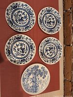 Front view of all five plates