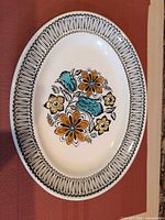 Front view of oval platter showing border and floral motif