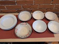 Assorted ceramic bowls in various sizes and patterns