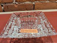 Top view of Nachtmann square crystal tea light holder showing brand label