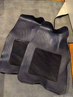 Both floor mats front side showing ribbed insert and overall shape