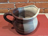 Side view showing two-tone glaze and handle