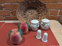 All three shaker pairs and wicker basket grouped together