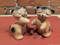 Front view of both ceramic hugging bear shakers