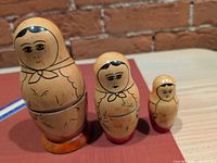 front view of all three nesting dolls standing by size