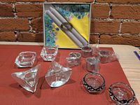 Group view of all glass pieces, boxed candles and napkins