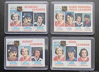 Fronts of four O-Pee-Chee 1978-79 NHL Stat Leaders cards in sleeves