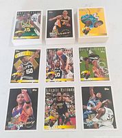 Stacks and nine highlighted 1995 Topps cards showing stars and subset designs