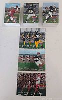 Stacks and laid-out selection of 1996 Playoff Absolute Football cards