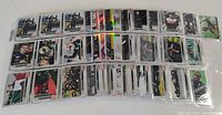 Overview of multiple 9-pocket pages showing assorted Topps Chrome F1 base and refractor cards