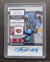 Front of 2010-11 Panini Playoff Contenders Alexander Burmistrov rookie autograph card in sleeve