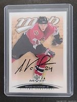 Front of autographed 2003-04 Upper Deck MVP Rookie Update card #301 in sleeve