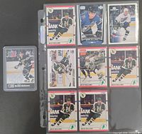 Autographed Pro Set card plus eight additional Bellows cards displayed in album page