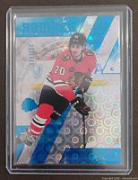 Front of Cole Guttman SPx Radiance Blue parallel card in top-loader