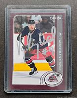 Front of 2002-03 O-Pee-Chee David Vyborny card showing photo, autograph, team logo and protective sleeve