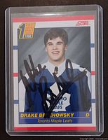 Front of autographed Drake Berehowsky Score rookie card in plastic holder