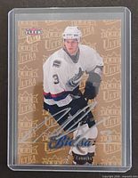 Front of Kevin Bieksa Gold Medallion autographed card in sleeve