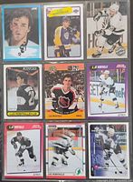 Overall shot of nine Luc Robitaille hockey cards in sleeve