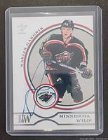 Front view of autographed Marian Gaborik Pacific Luxury Suite card in sleeve