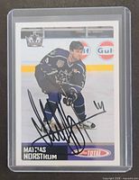 Front of autographed Mattias Norström Topps Total card in holder