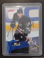 Front view of autographed Matt Cooke Victory card in holder