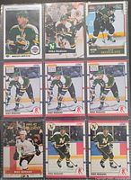 Nine Mike Modano hockey cards in binder sleeve, showing fronts for identification
