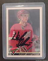 Front of autographed Nicklas Lidstrom O-Pee-Chee Premier card in plastic holder