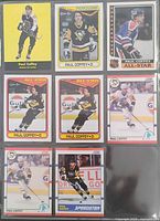 Front view of all eight Paul Coffey cards in plastic nine-pocket sleeve