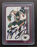 Front of autographed Pierre-Marc Bouchard rookie card in holder