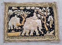 Front view of embroidered tapestry showing full scene and border