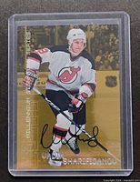 Front view of autographed Sharifijanov card in holder