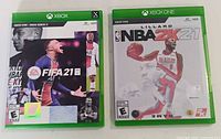Front view of FIFA 21 and NBA 2K21 cases