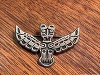 Front view showing full totem eagle design and surface condition