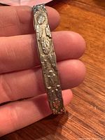 Outer view of textured Aztec design on bangle