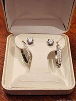 Earrings in box, front view