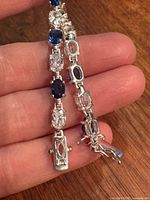 Close-up of clasp and alternating blue and clear stones