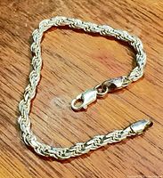 Full view of sterling silver rope chain bracelet showing lobster clasp and overall condition