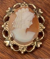 Front view of shell cameo brooch