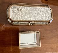 Elongated octagonal glass trinket box and smaller square box closed